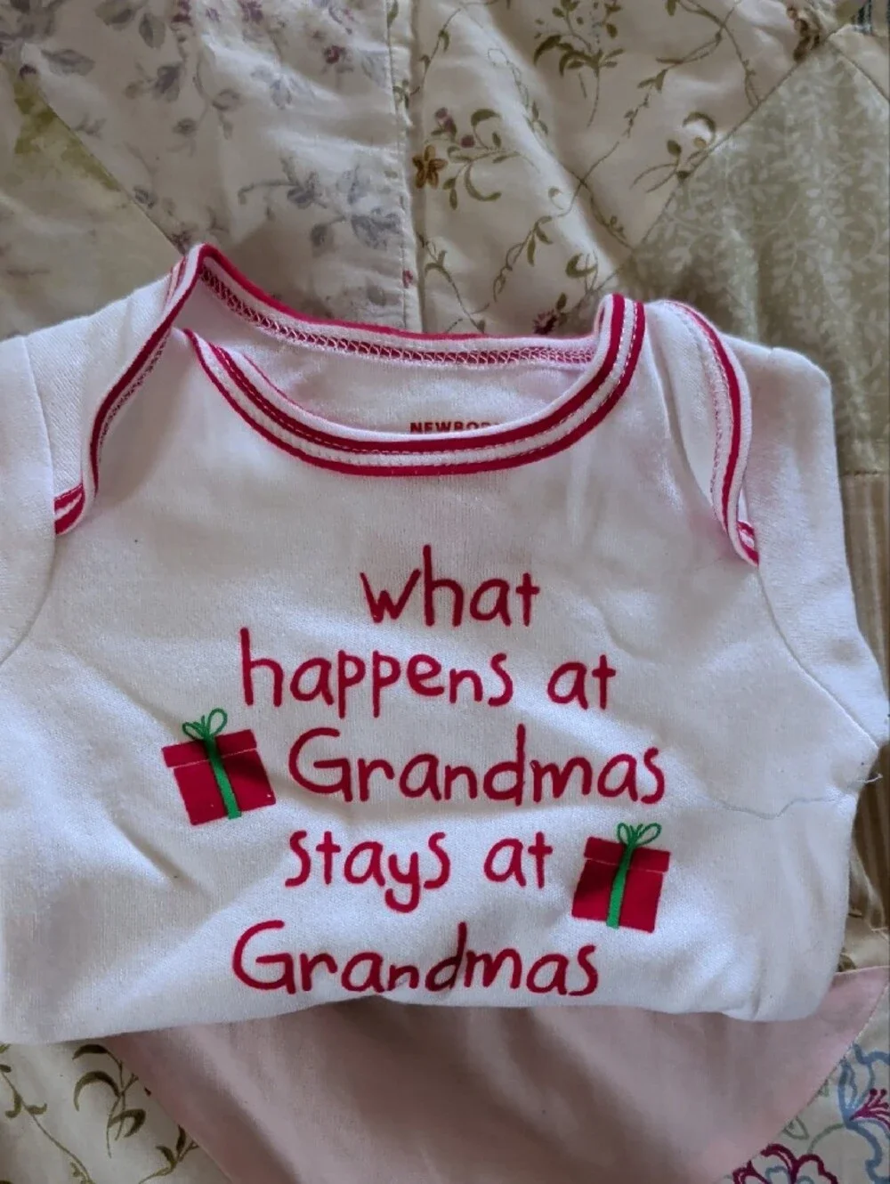 White Baby Onesie with Pink Trim and Holiday Gift Graphic